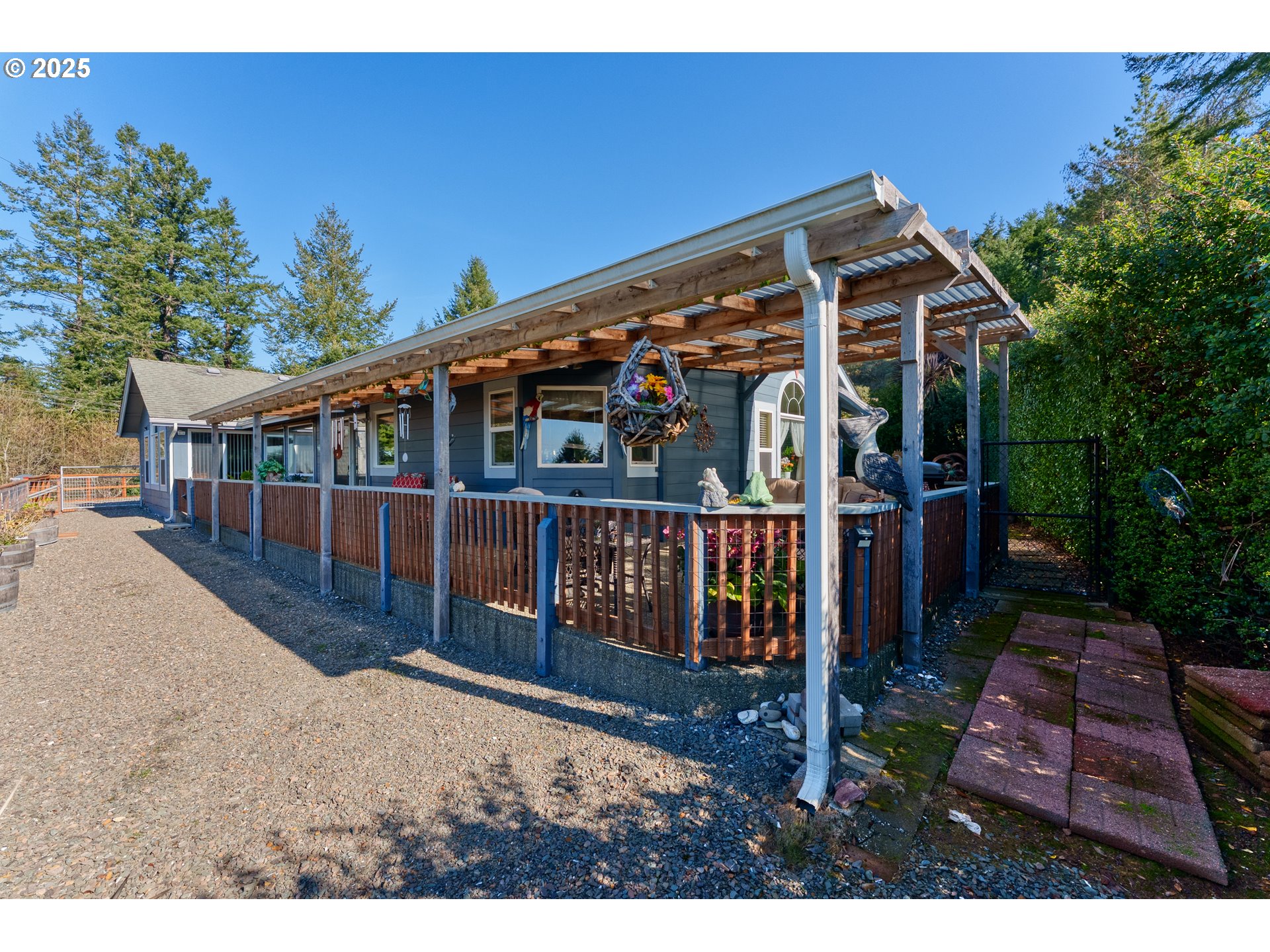 838 Marina Heights Road Brookings, OR 97415 - Photo 15 of 47 a view of an house with a yard