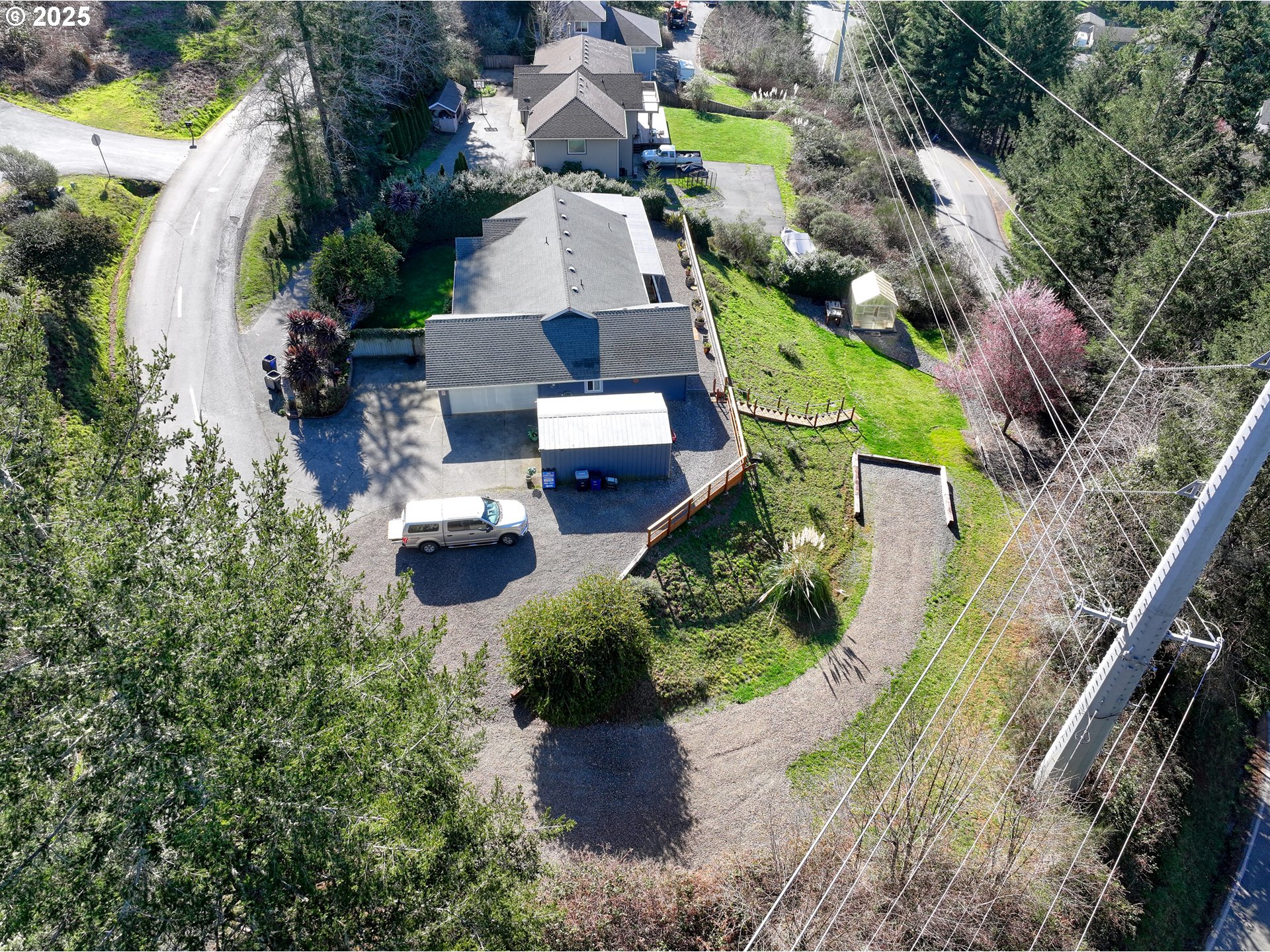 838 Marina Heights Road Brookings, OR 97415 - Photo 2 of 47 an aerial view of a house with a garden and plants