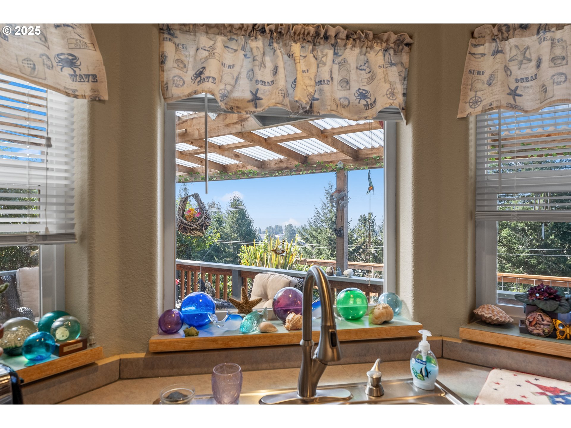 838 Marina Heights Road Brookings, OR 97415 - Photo 26 of 47 a outdoor living room with furniture and a potted plant