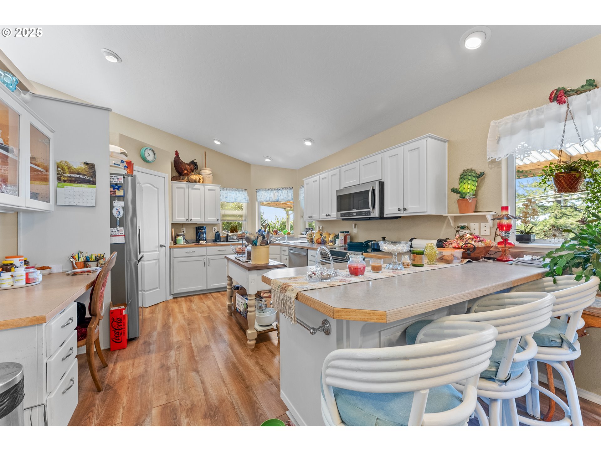 838 Marina Heights Road Brookings, OR 97415 - Photo 28 of 47 a room with stainless steel appliances lots of furniture and clutter
