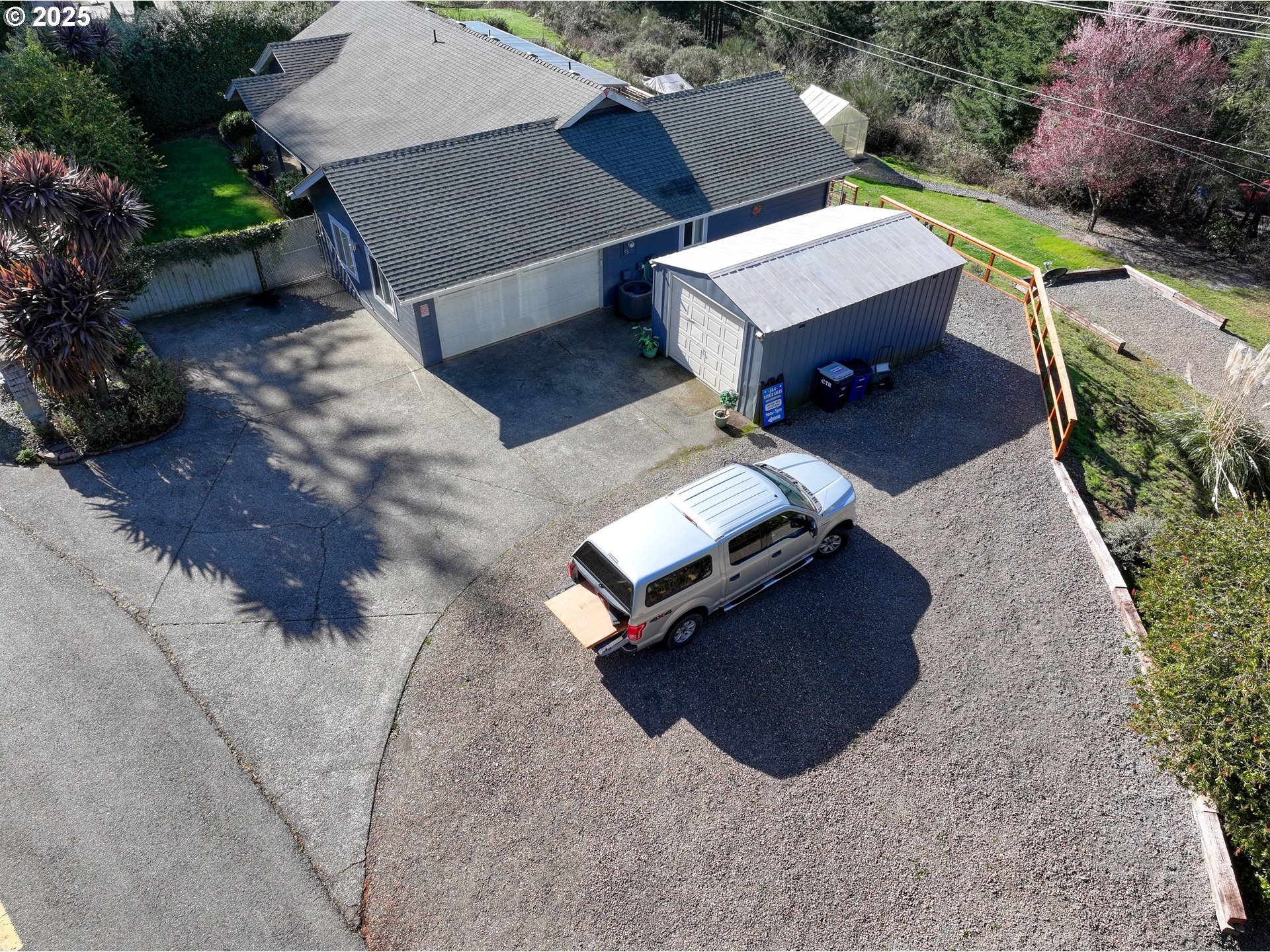 838 Marina Heights Road Brookings, OR 97415 - Photo 3 of 47 an aerial view of a house with a backyard space and balcony