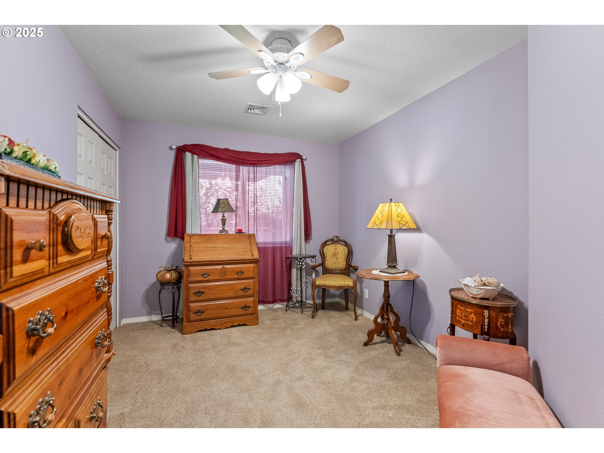 838 Marina Heights Road Brookings, OR 97415 - Photo 33 of 47 a bedroom with furniture and a chandelier