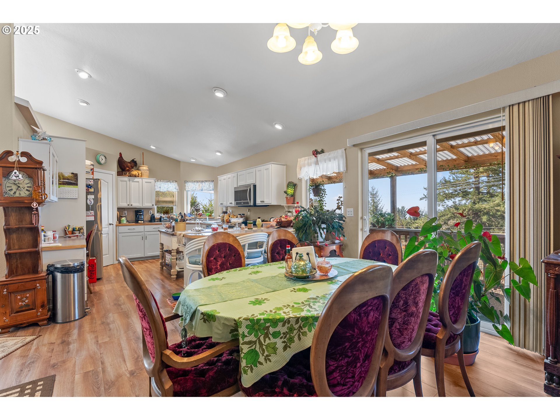 838 Marina Heights Road Brookings, OR 97415 - Photo 34 of 47 a view of a dining room with furniture window and wooden floor