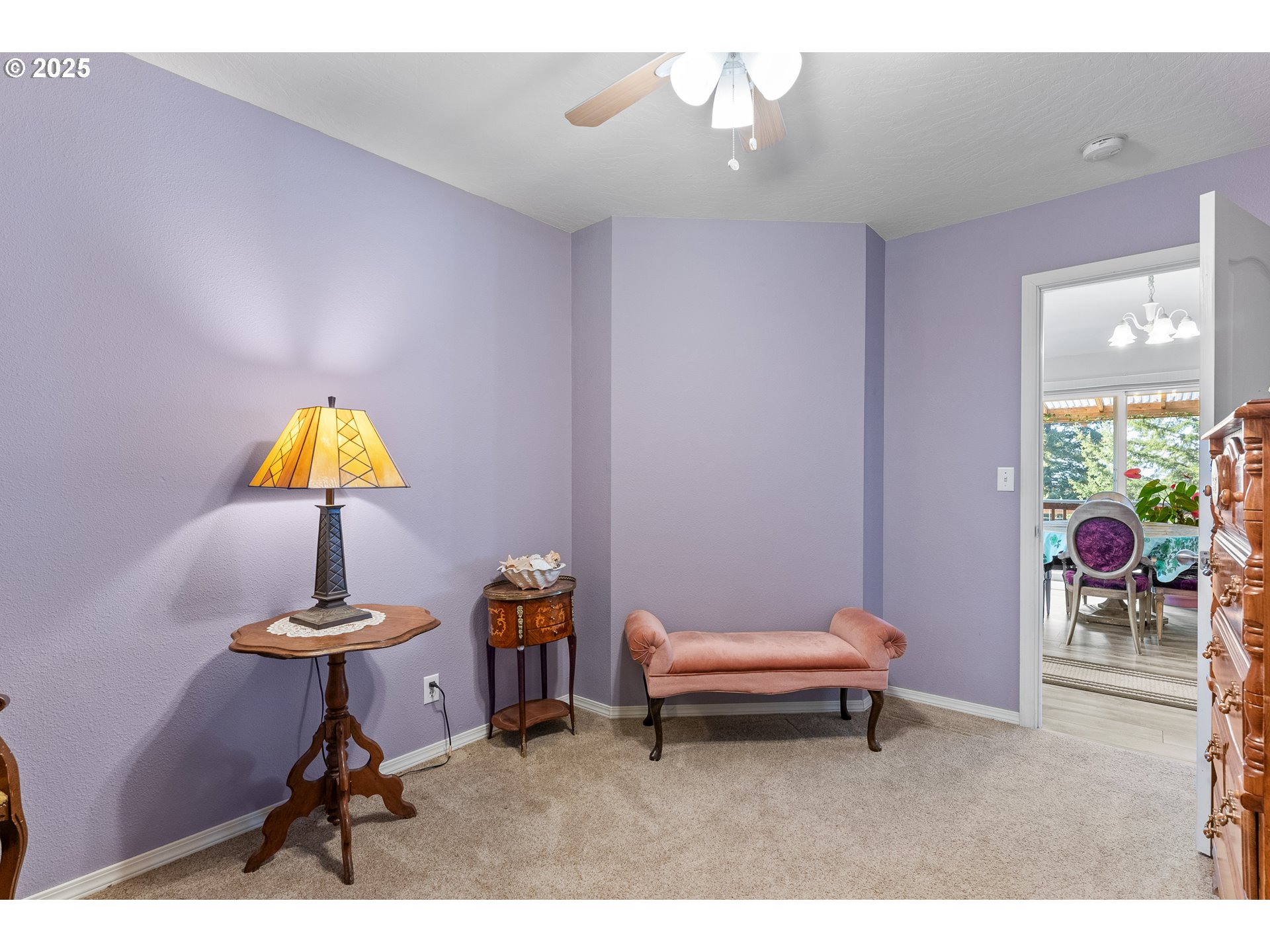 838 Marina Heights Road Brookings, OR 97415 - Photo 36 of 47 a living room with furniture and a chandelier