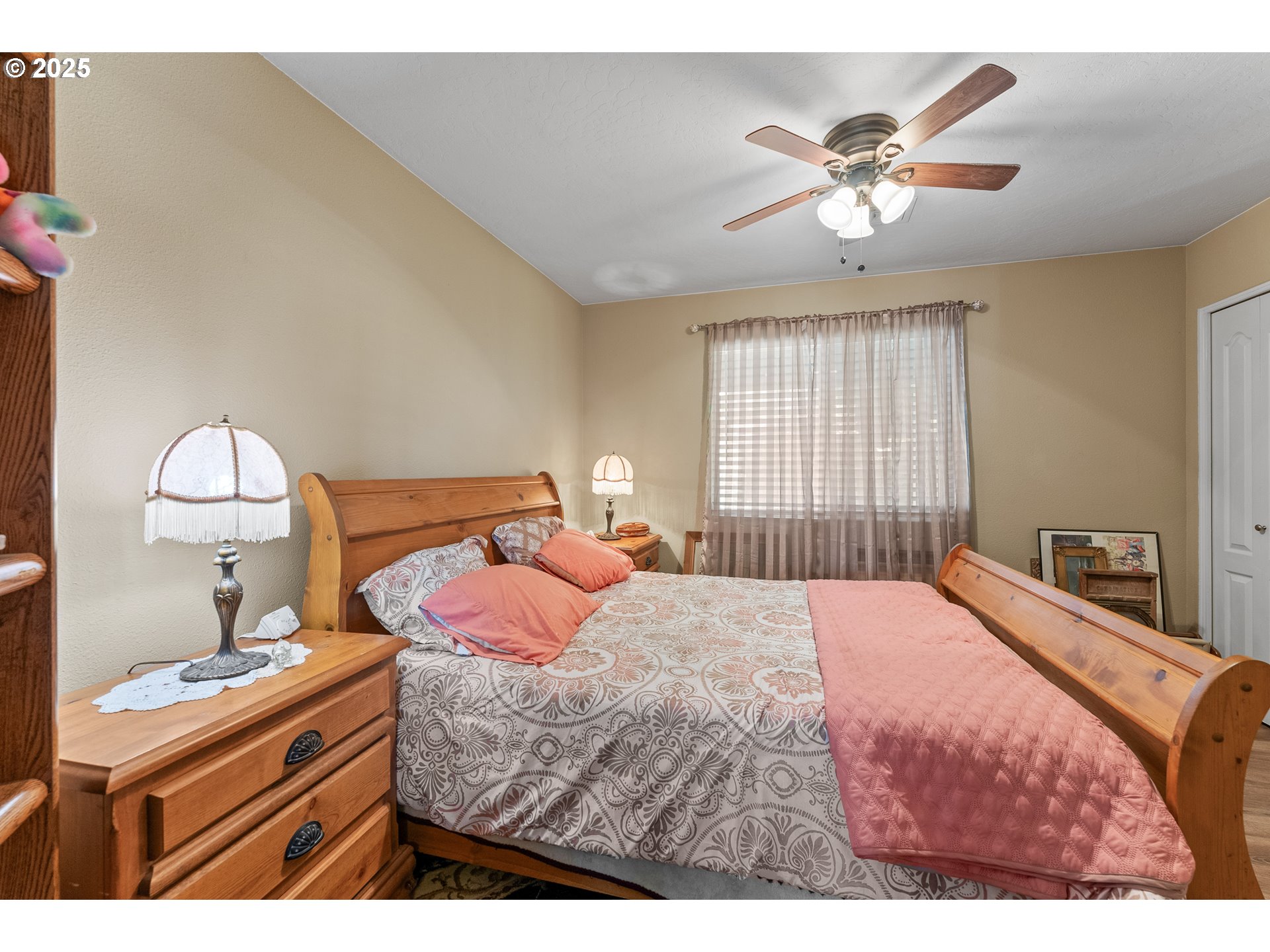 838 Marina Heights Road Brookings, OR 97415 - Photo 37 of 47 a bedroom with a bed and a chandelier