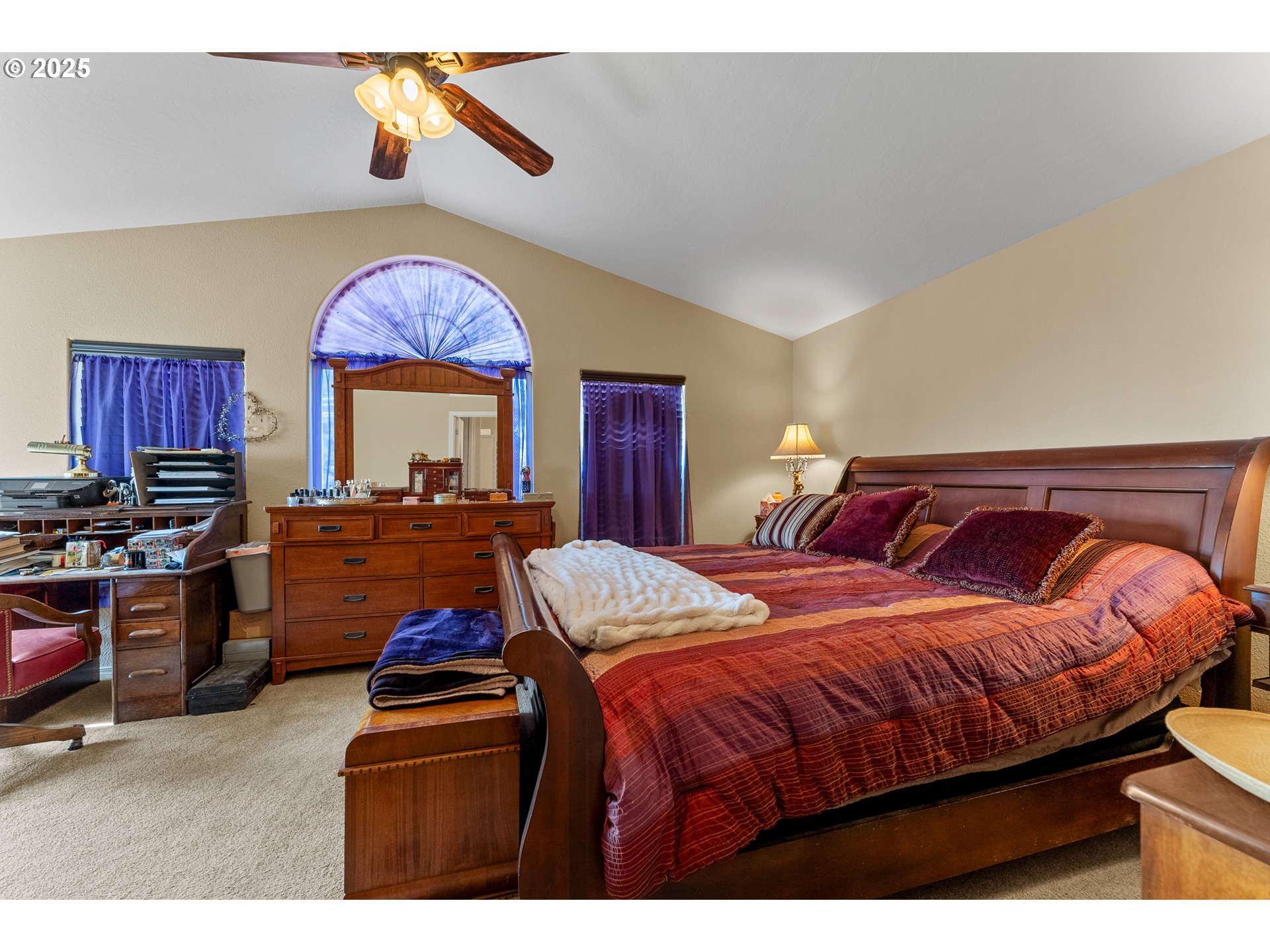 838 Marina Heights Road Brookings, OR 97415 - Photo 39 of 47 a bedroom with bed and a chandelier