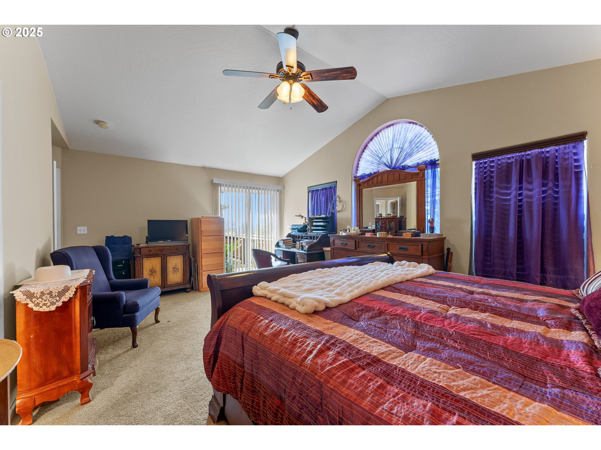 838 Marina Heights Road Brookings, OR 97415 - Photo 40 of 47 a bed room with a bed and a chandelier