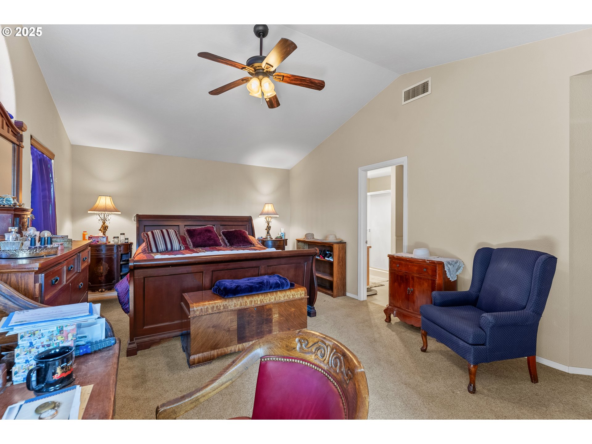 838 Marina Heights Road Brookings, OR 97415 - Photo 41 of 47 a living room with furniture a rug and a chandelier