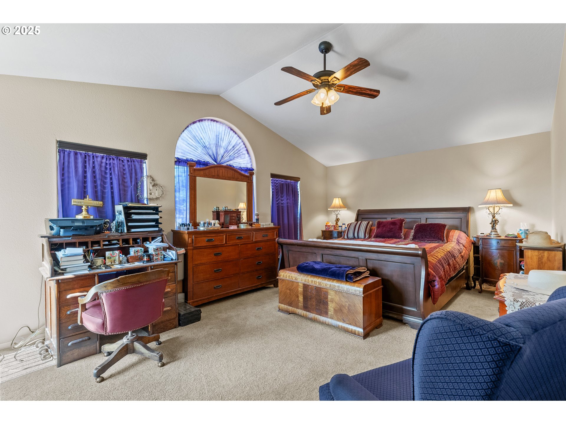 838 Marina Heights Road Brookings, OR 97415 - Photo 42 of 47 a bedroom with furniture and a chandelier