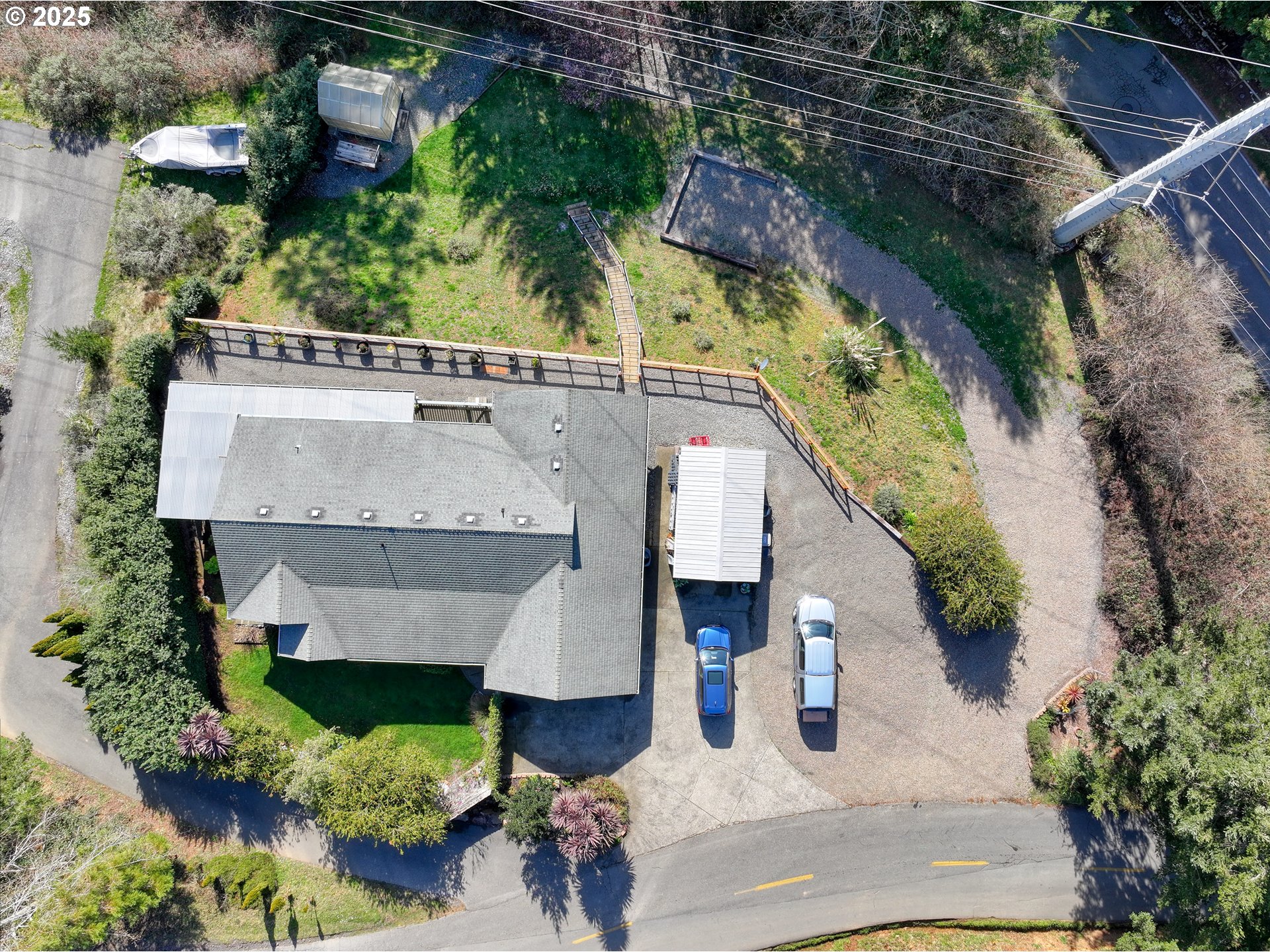 838 Marina Heights Road Brookings, OR 97415 - Photo 47 of 47 an aerial view of a house with a yard and garden