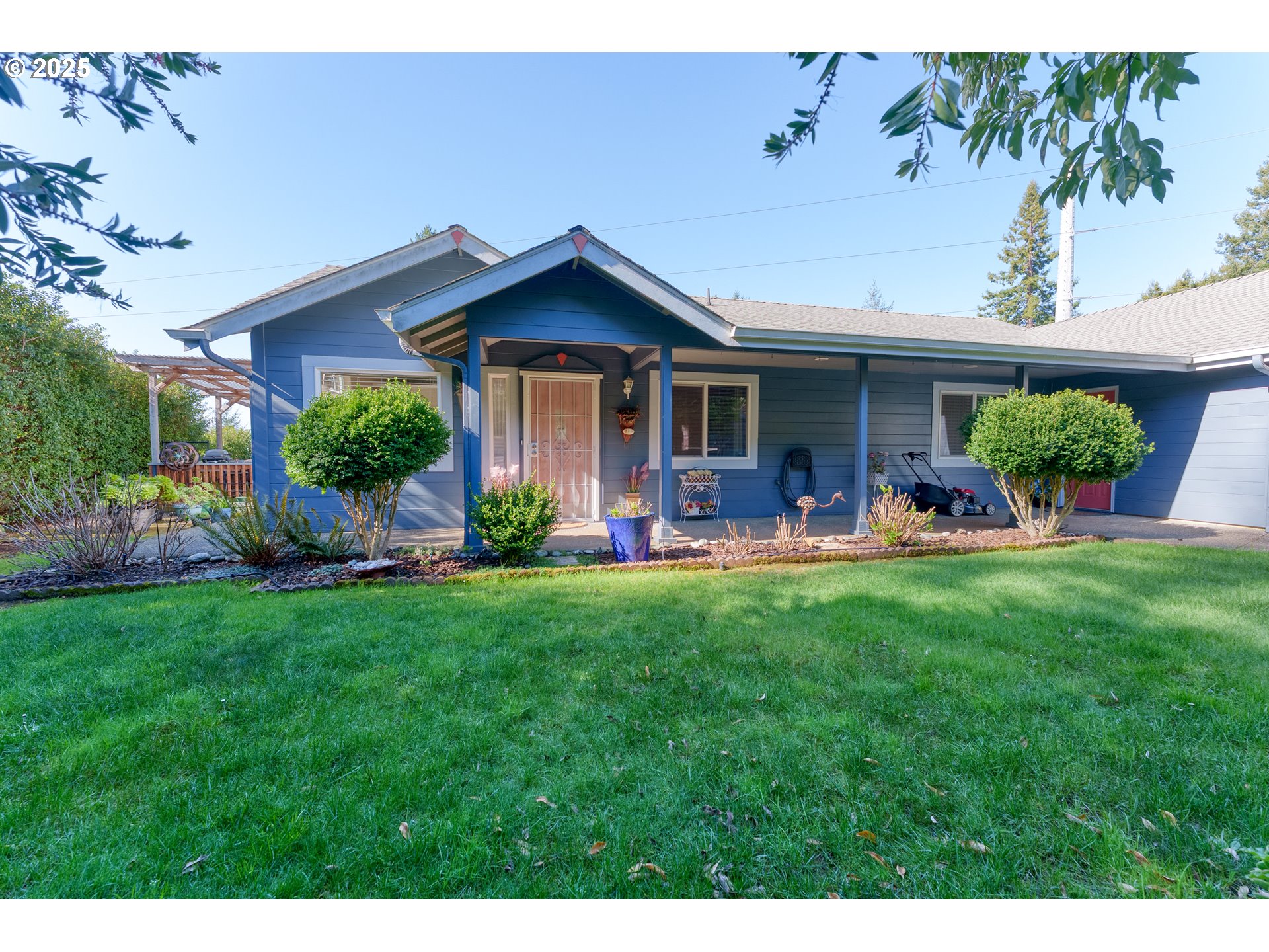 838 Marina Heights Road Brookings, OR 97415 - Photo 10 of 47 a front view of a house with garden