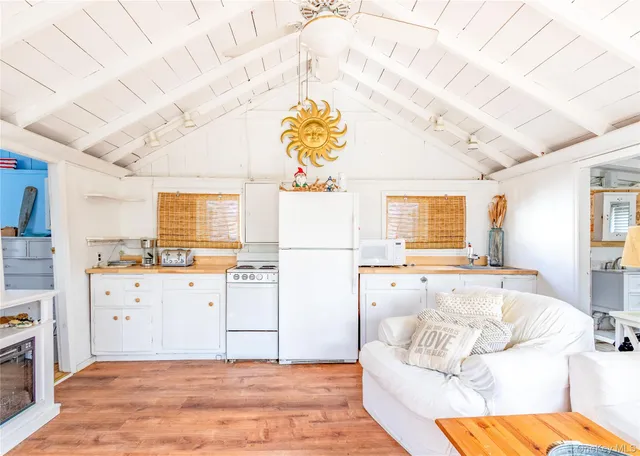 a spacious bedroom with a bed and a window