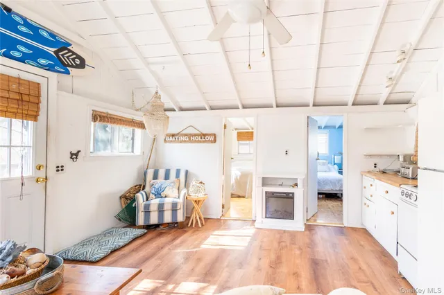 a spacious bedroom with a bed and a window