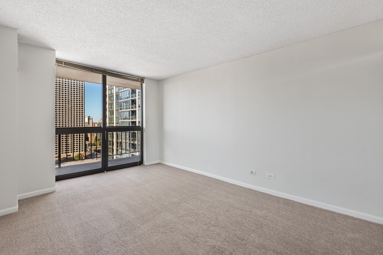 33 West Delaware Place, Unit 22H Chicago, IL 60610 - Photo 11 of 23 a view of an empty room with a window