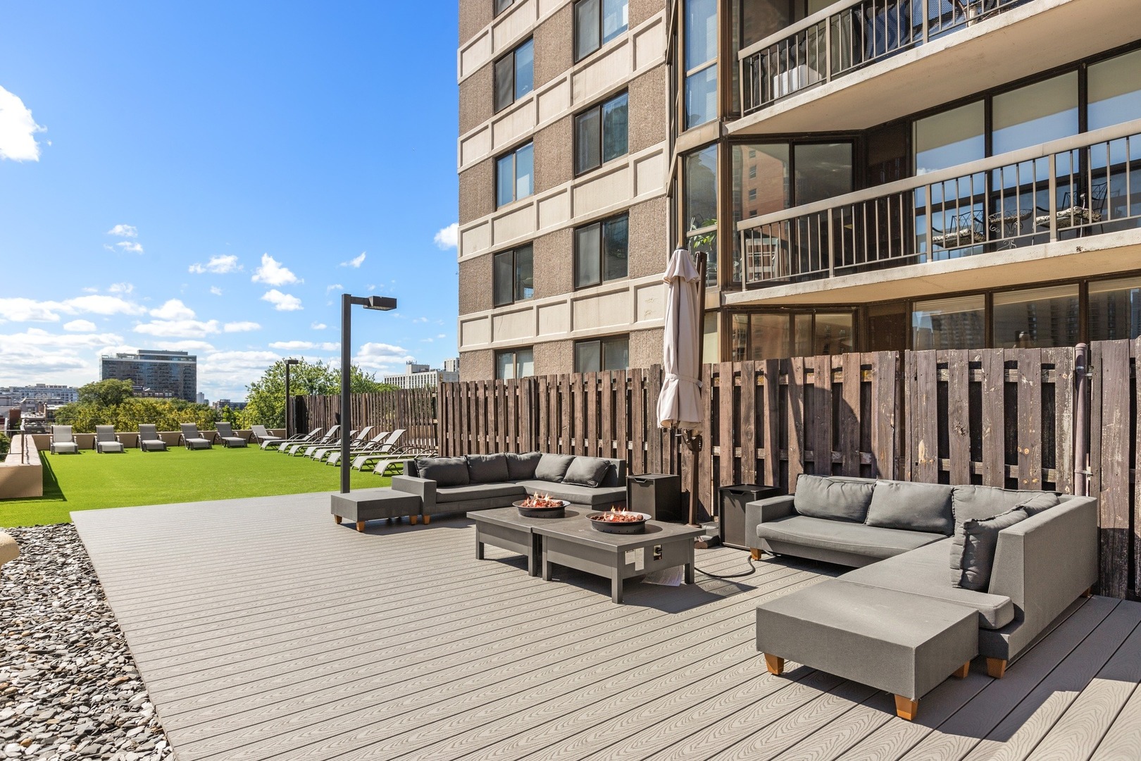 33 West Delaware Place, Unit 22H Chicago, IL 60610 - Photo 18 of 23 a view of a patio with couches table and chairs