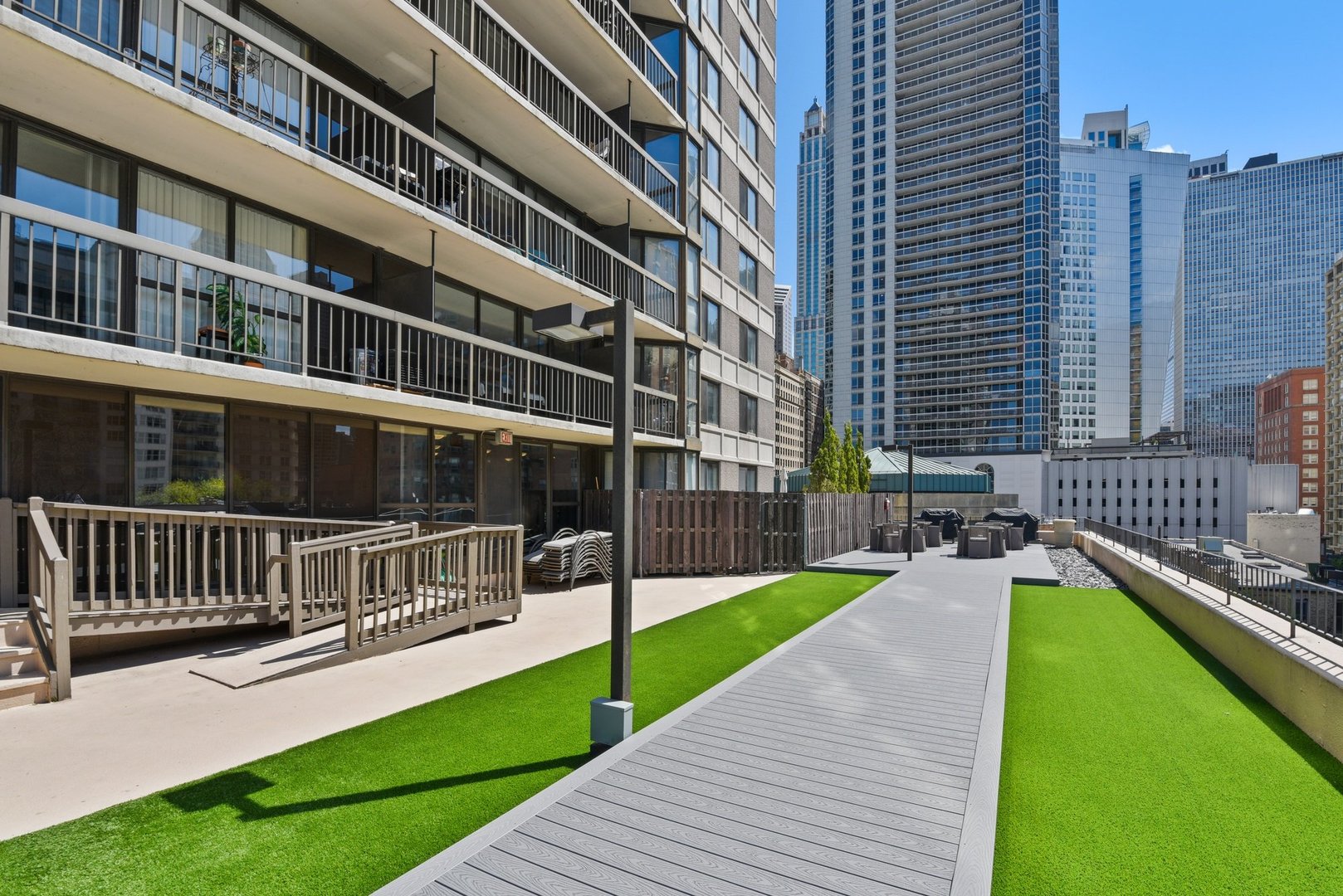 33 West Delaware Place, Unit 22H Chicago, IL 60610 - Photo 20 of 23 a view of a building with a deck