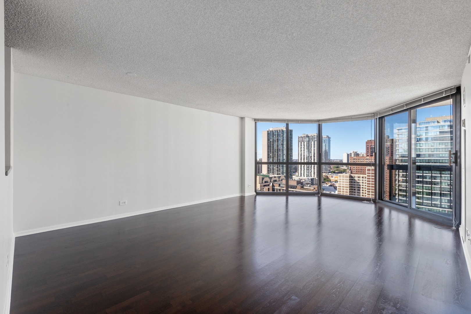 33 West Delaware Place, Unit 22H Chicago, IL 60610 - Photo 7 of 23 a view of a livingroom with furniture and wooden floor