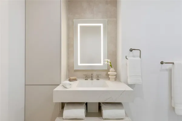 a bathroom with a sink and a mirror