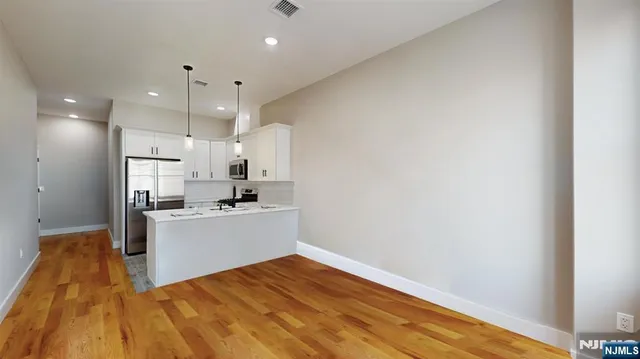 a view of kitchen with wooden floor