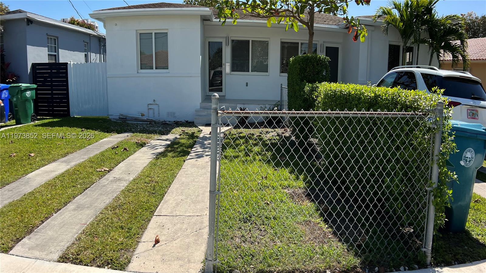 2800 Southwest 25th Street, Unit 1 Miami, FL 33133 - Photo 1 of 48 a front view of a house with a yard