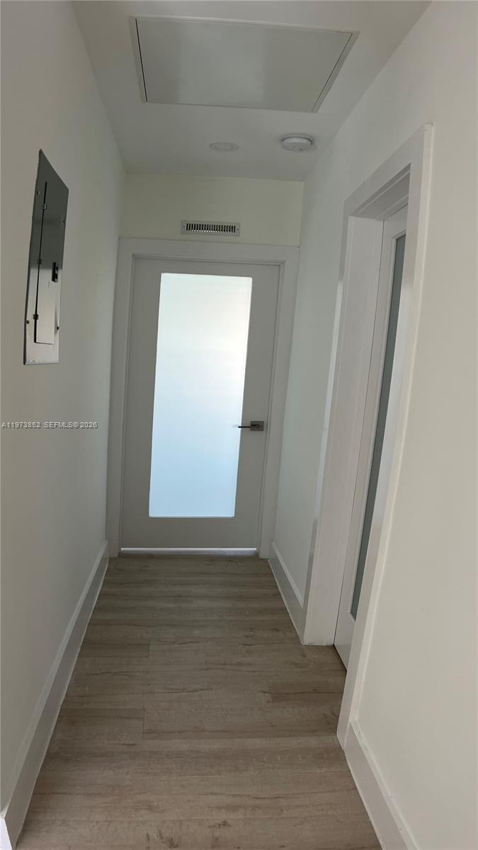 2800 Southwest 25th Street, Unit 1 Miami, FL 33133 - Photo 17 of 48 a view of an empty room and window