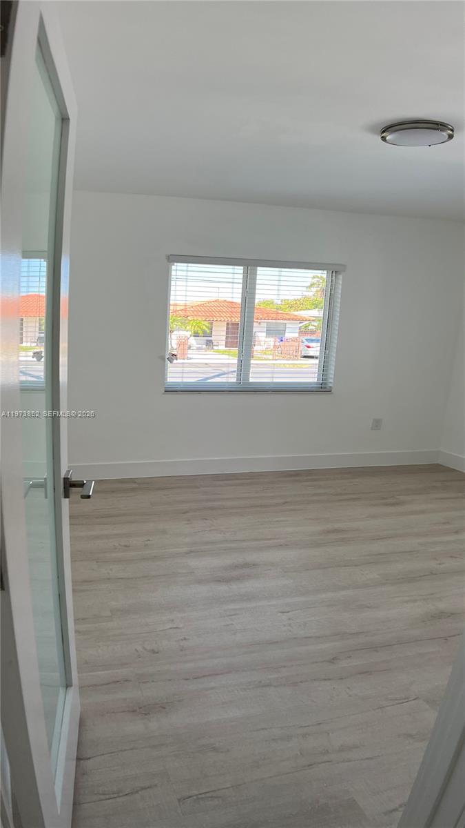2800 Southwest 25th Street, Unit 1 Miami, FL 33133 - Photo 19 of 48 en empty room with window
