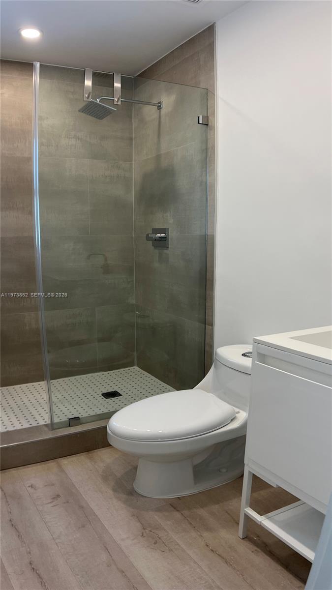 2800 Southwest 25th Street, Unit 1 Miami, FL 33133 - Photo 26 of 48 a bathroom with a toilet and a shower