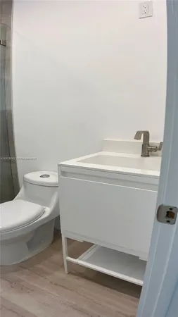 a bathroom with a shower and a toilet