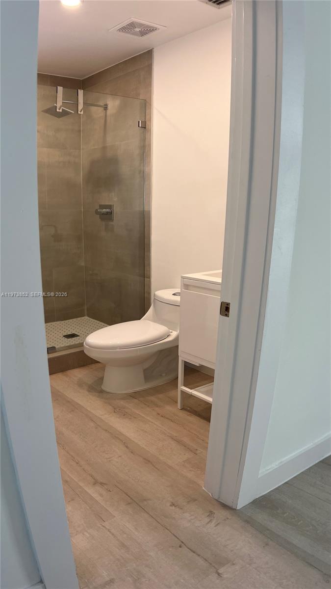 2800 Southwest 25th Street, Unit 1 Miami, FL 33133 - Photo 30 of 48 a bathroom with a toilet and a shower