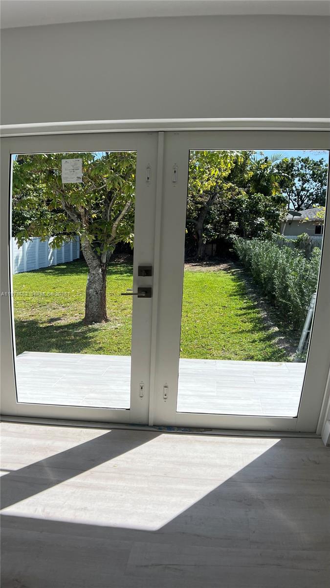 2800 Southwest 25th Street, Unit 1 Miami, FL 33133 - Photo 41 of 48 a view of a door and a yard