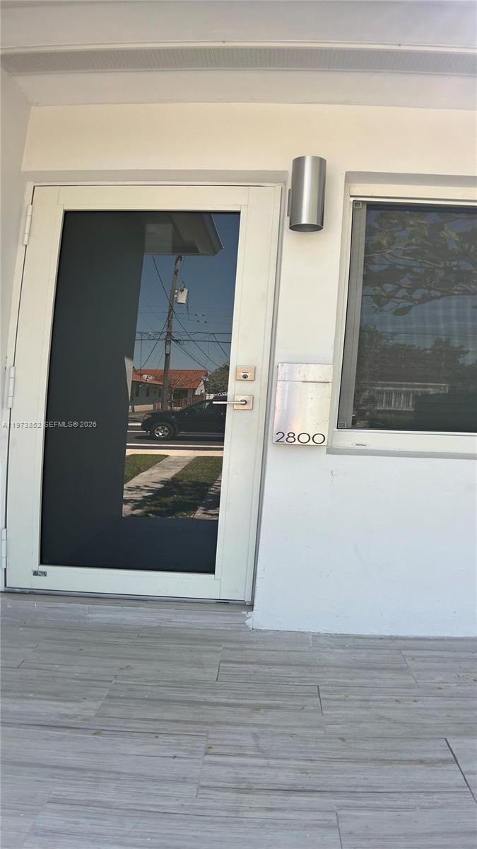 2800 Southwest 25th Street, Unit 1 Miami, FL 33133 - Photo 6 of 48 a view of a car garage door