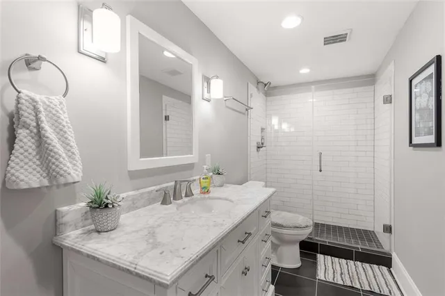 a bedroom with bed couch and window