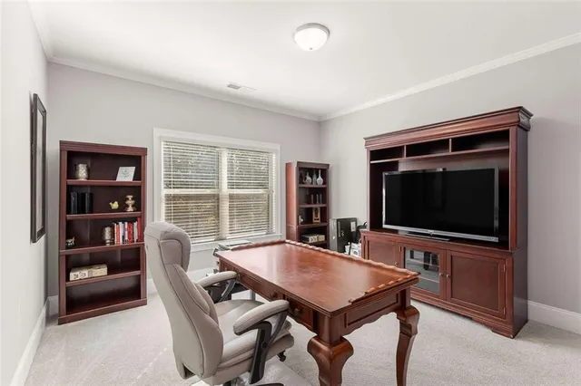 a bedroom with a bed and a dresser in it