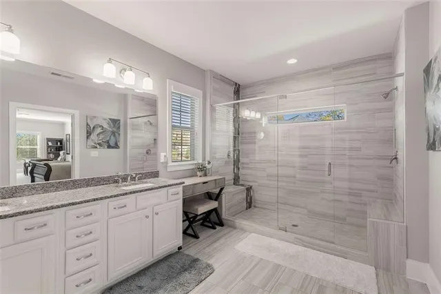 a bedroom with a bed and dresser