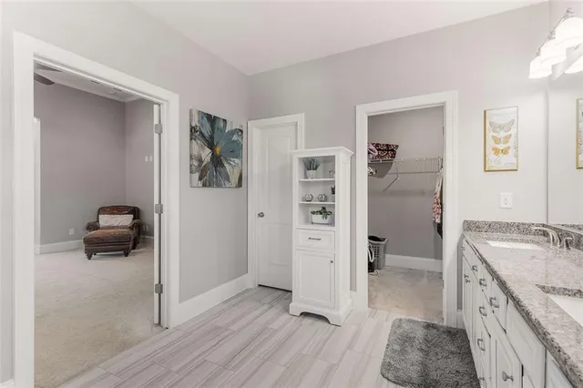 a bathroom with a sink toilet and shower curtain
