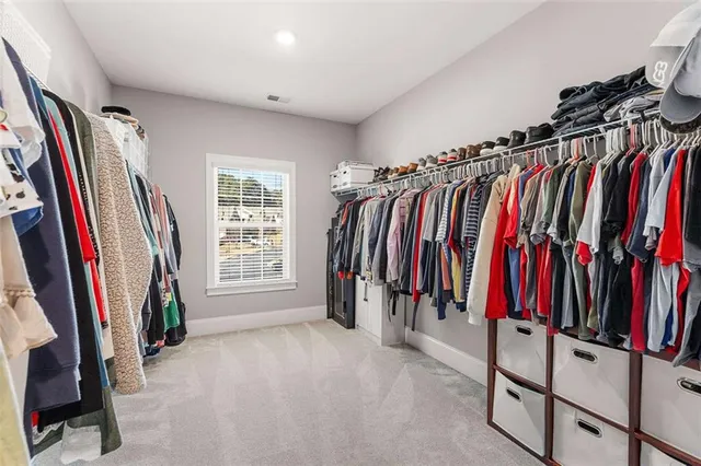 a bedroom with bed and a window