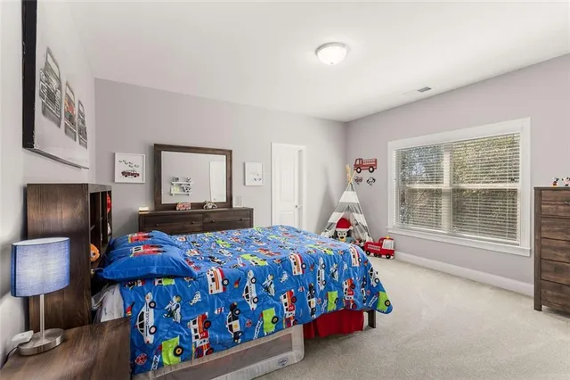 a bathroom with a sink and mirror with toilet