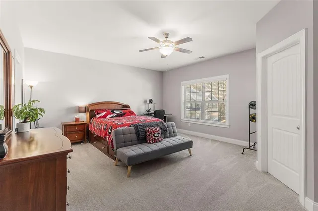 a living room with furniture and a clock