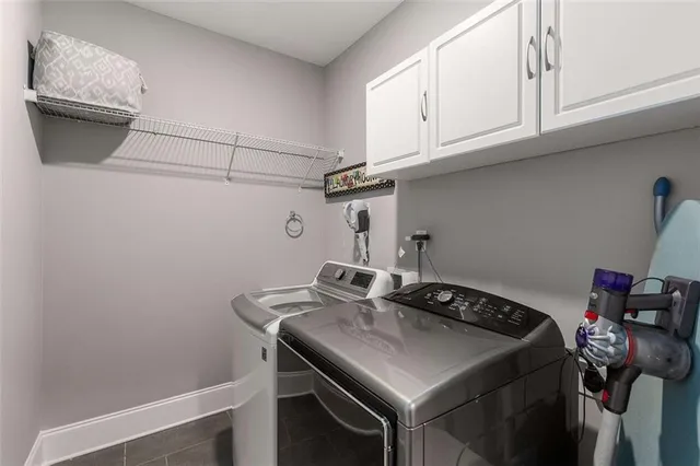a bathroom with a tub a sink and a window