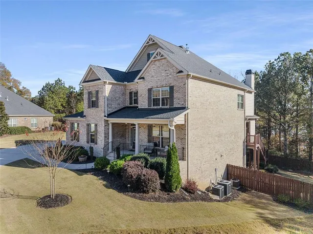 a view of living room with furniture and wooden floor