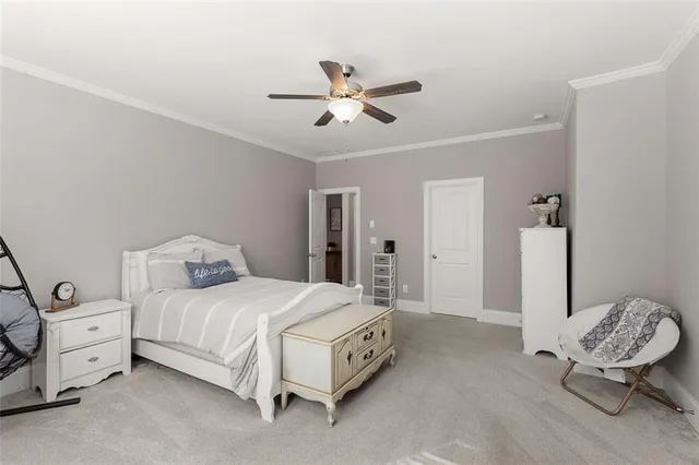 a living room with fireplace furniture and a floor to ceiling window