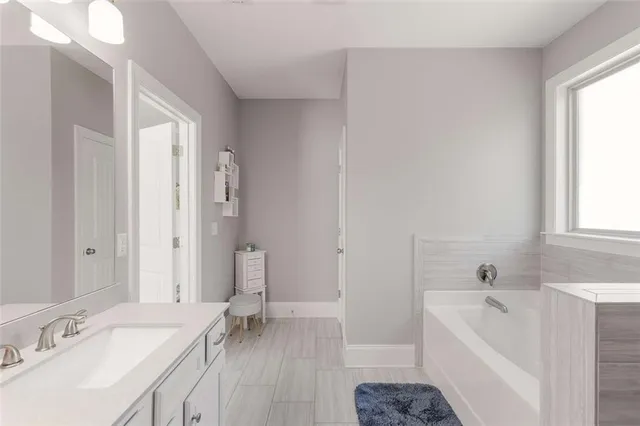 a view of a yard with plants and trees