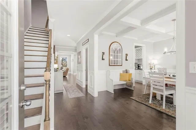 a view of a dining room with furniture and window