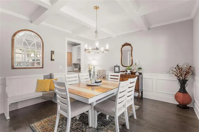 a kitchen with kitchen island granite countertop a sink a center island and appliances