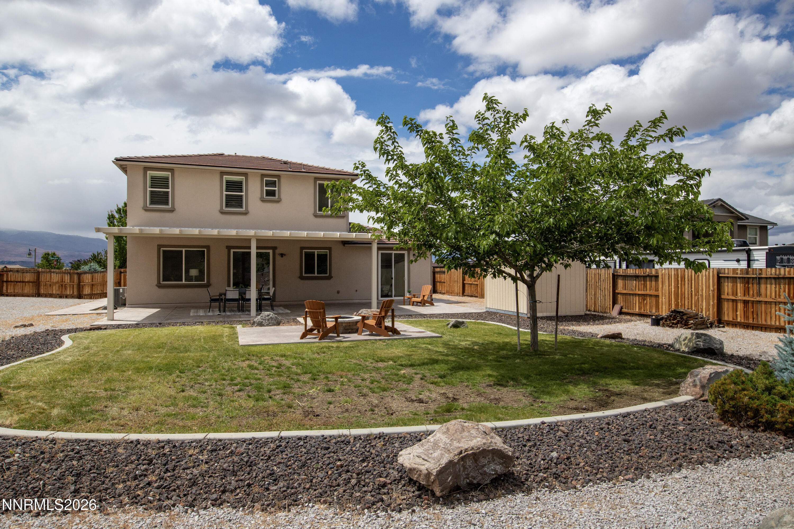 10150 Barrel Racer Drive Reno, NV 89521 - Photo 3 of 64 a view of a house with a yard porch and sitting area