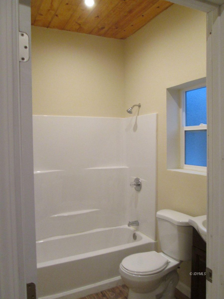 52810 Pine Cove Road Pine Cove, CA 92549 - Photo 12 of 12 a bathroom with a toilet and shower