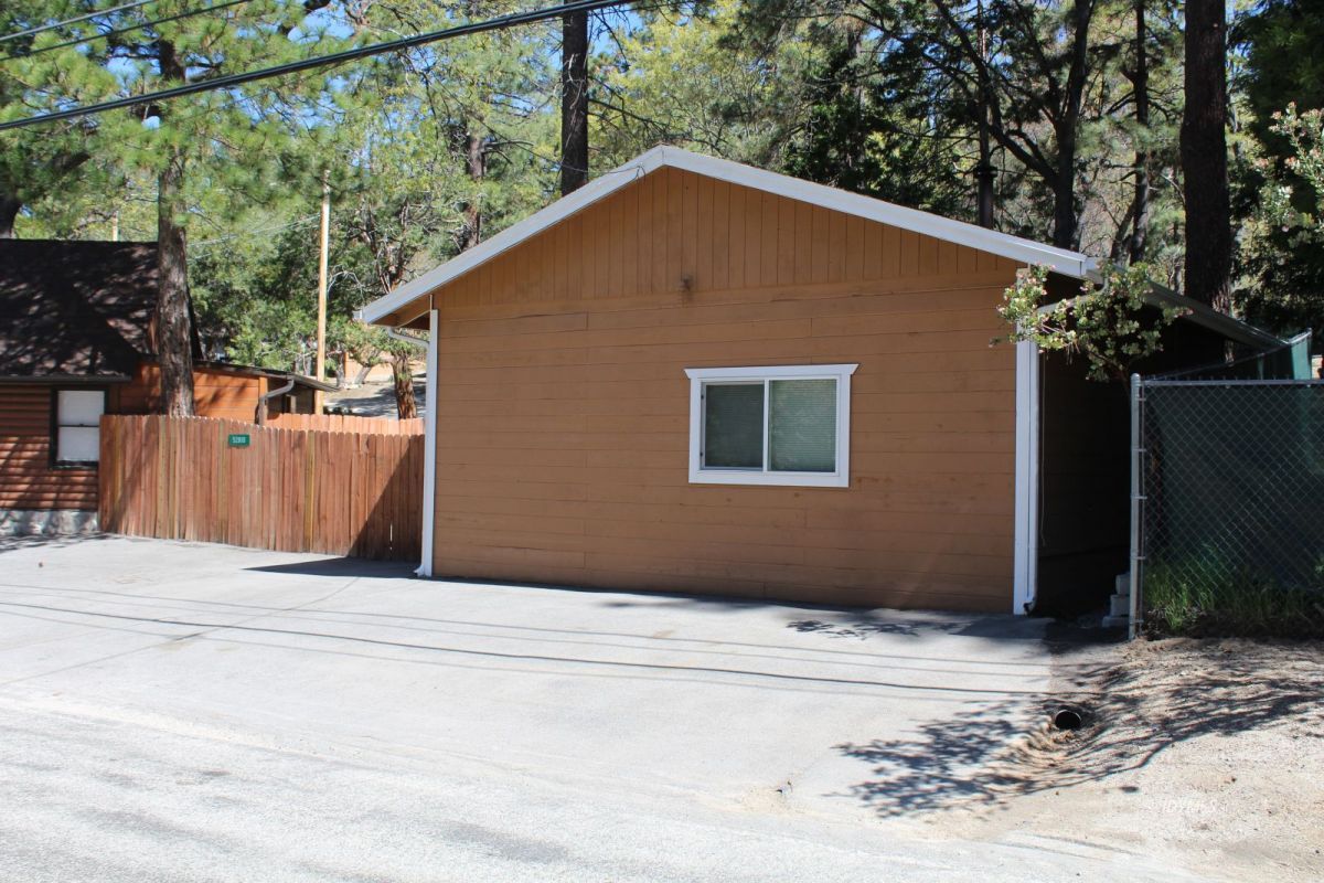 52810 Pine Cove Road Pine Cove, CA 92549 - Photo 2 of 12 a house with trees in the background