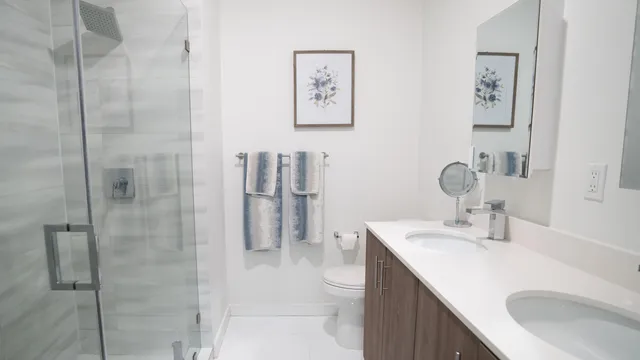 a bathroom with a sink toilet and shower