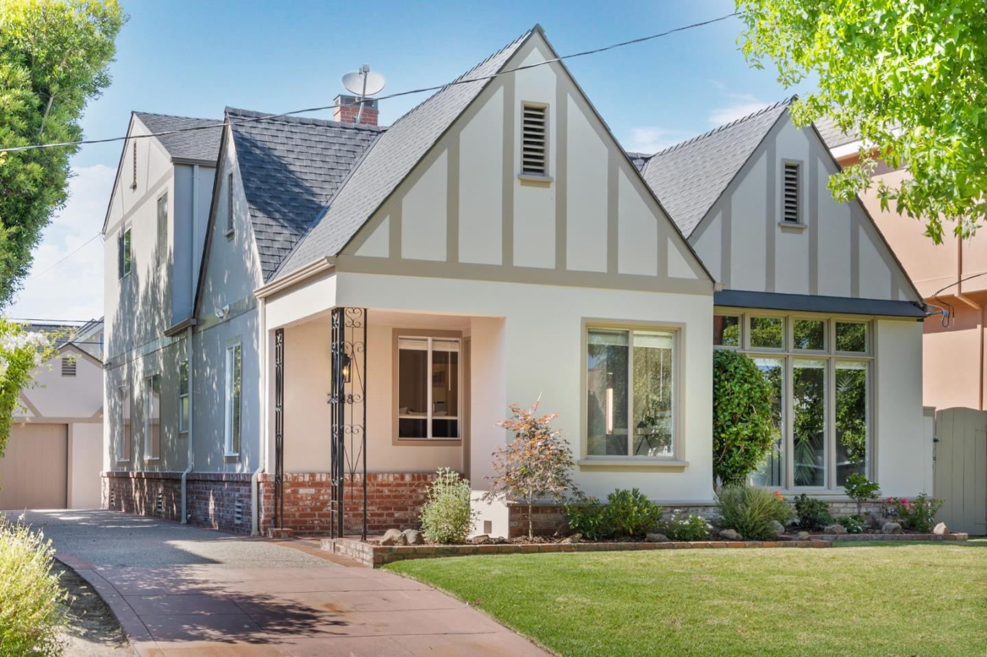a front view of a house with garden