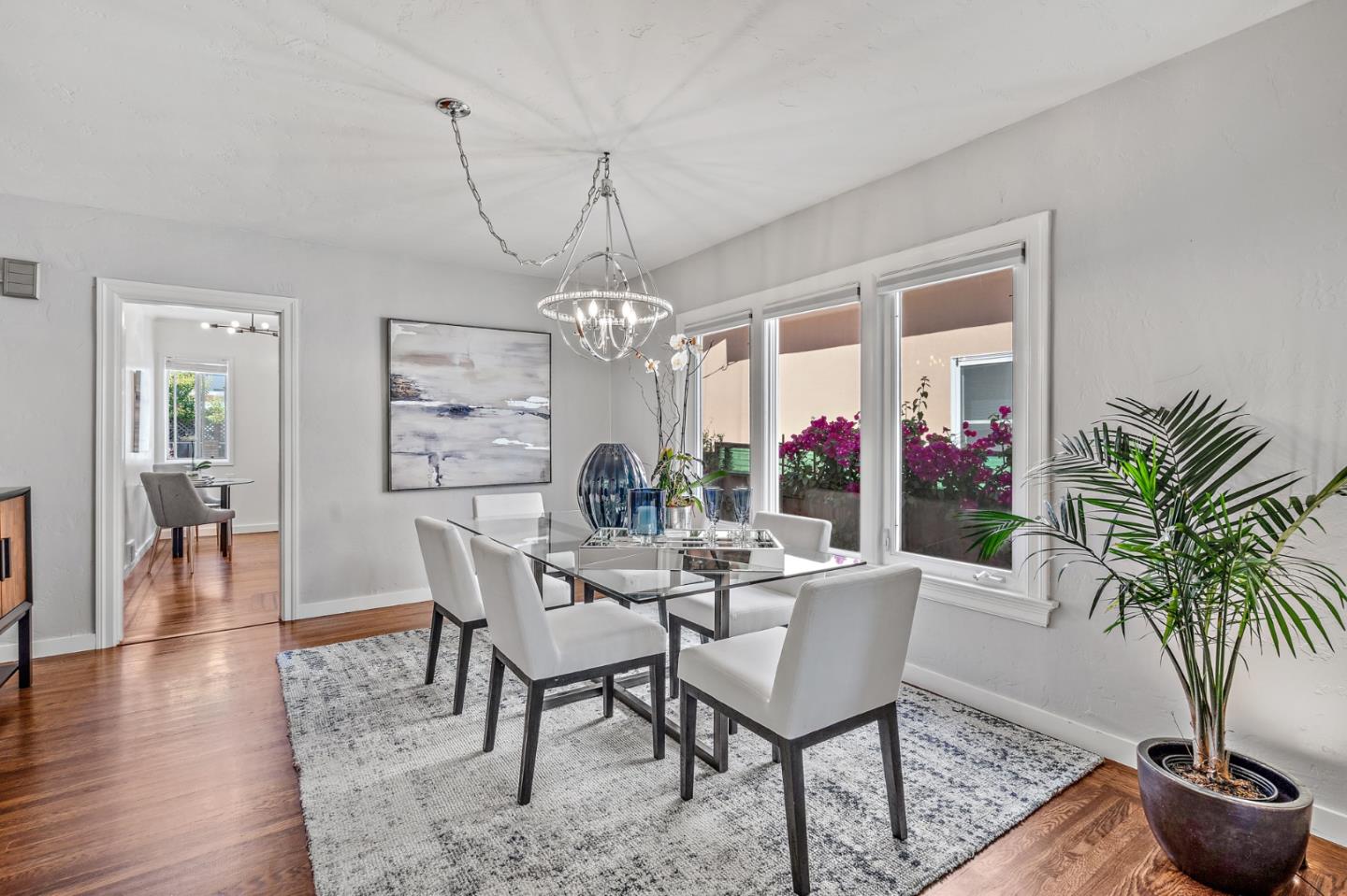 2218 Hale Drive Burlingame, CA 94010 - Photo 11 of 45 a view of a dining room with furniture wooden floor and chandelier
